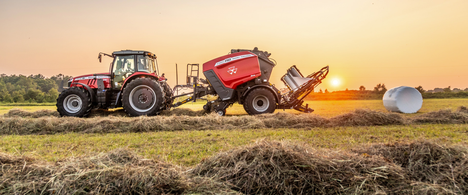 Massey Ferguson baler emptying a twine-wrapped bale.